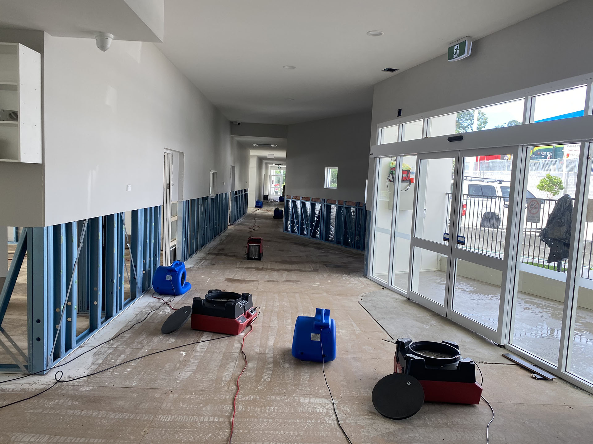 repair equipment in a water damaged hallway